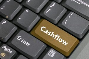 Een computertoetsenbord ontworpen met een cashflow-thema.